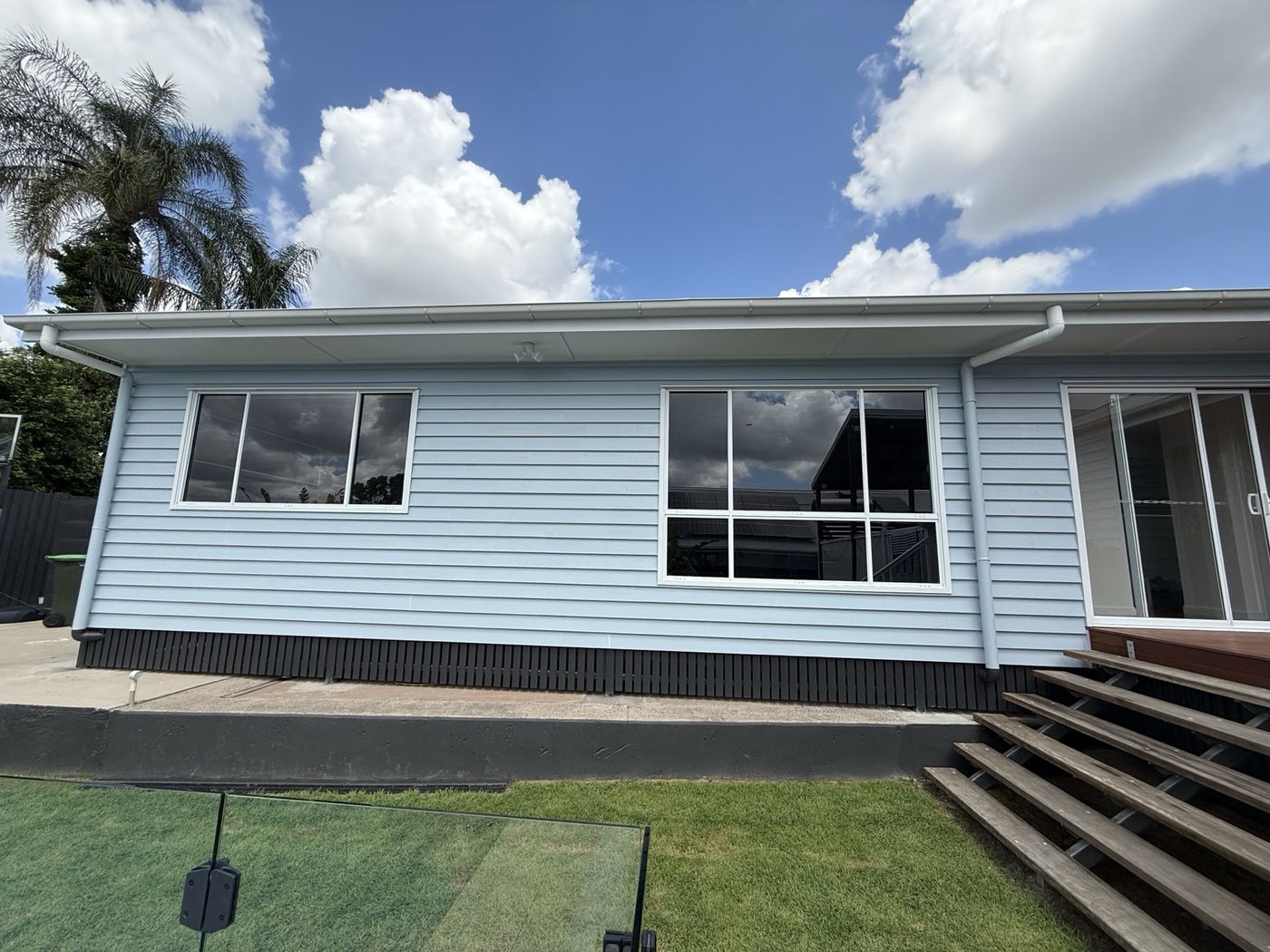 Residential window tinting blue weatherboard home